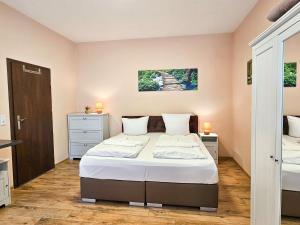 a bedroom with a bed and two night stands at Villa Utpatel Whg 02 in Ahlbeck +25 photos
