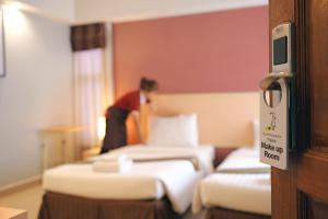 Postel nebo postele na pokoji v ubytování Tubtim Siam Suvarnabhumi Hotel