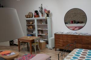 a room with a dresser and a table and a mirror at ‘Museum Loft’ Scotland’s Wee Hat Museum in Newburgh