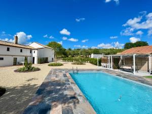 a swimming pool in the backyard of a house at Casale Fontessa in Citta' Sant'Angelo