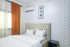 Postel nebo postele na pokoji v ubytování KK Lodging Yaounde Fouda