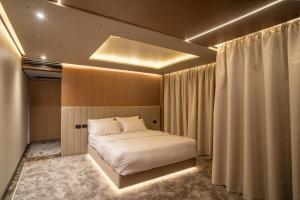 a bedroom with a white bed in a room at Supperyacht Jack Sparrow in Hurghada