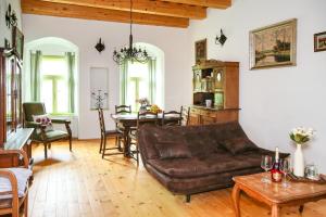 a living room with a couch and a table at Zlatý Mešec in Banská Štiavnica