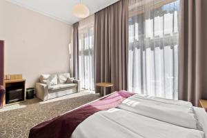 Postel nebo postele na pokoji v ubytování Hotel Schild
