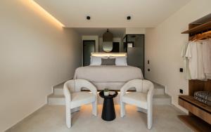 Llit o llits en una habitació de Nimfi Suites