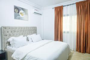 Postel nebo postele na pokoji v ubytování KK Lodging Yaounde Fouda