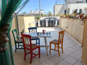 a table and chairs sitting on a patio at Fata Morgana in Casamassella