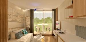 a living room with a couch and a table at Studio près de la plage in La Grande-Motte