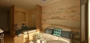 a bedroom with a bed and a painting on the wall at Studio près de la plage in La Grande-Motte