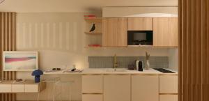 a kitchen with a sink and a microwave at Studio près de la plage in La Grande-Motte