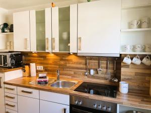 Kuchyň nebo kuchyňský kout v ubytování Leuchtturm + 19 fotografií