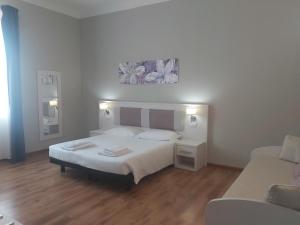 Postel nebo postele na pokoji v ubytování Lodges le Mura