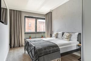 Posteľ alebo postele v izbe v ubytovaní Scala 60C City Center Apartments with Parking by Lion Apartments