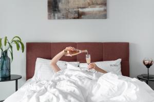 Posteľ alebo postele v izbe v ubytovaní Scala 60C City Center Apartments with Parking by Lion Apartments