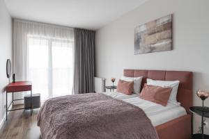 Posteľ alebo postele v izbe v ubytovaní Scala 60C City Center Apartments with Parking by Lion Apartments