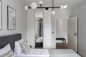 Posteľ alebo postele v izbe v ubytovaní Scala 60C City Center Apartments with Parking by Lion Apartments