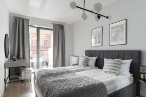 Posteľ alebo postele v izbe v ubytovaní Scala 60C City Center Apartments with Parking by Lion Apartments