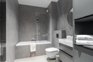 Kúpeľňa v ubytovaní Scala 60C City Center Apartments with Parking by Lion Apartments