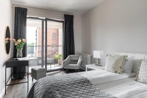 Posteľ alebo postele v izbe v ubytovaní Scala 60C City Center Apartments with Parking by Lion Apartments