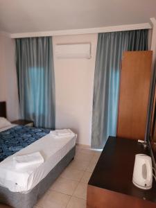 Postel nebo postele na pokoji v ubytování Best Hotel