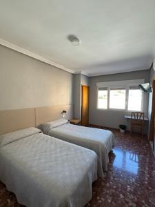 Postel nebo postele na pokoji v ubytování L'Oncle Pere Habitacions