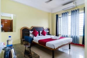 Postel nebo postele na pokoji v ubytování HOTEL NILADRII GALAXY