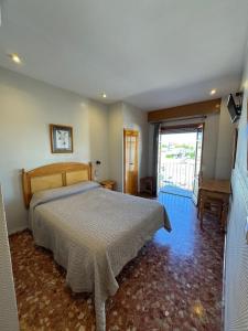 Postel nebo postele na pokoji v ubytování L'Oncle Pere Habitacions