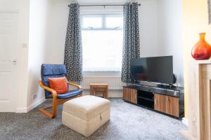 TV a/nebo společenská místnost v ubytování Thirlmere House