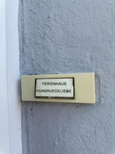 a sign on the side of a building at Ferienhaus Hunsrückliebe in Liederbach
