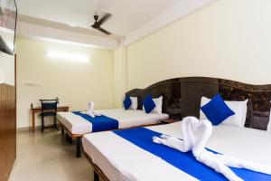 HOTEL NILADRII GALAXY客房内的一张或多张床位