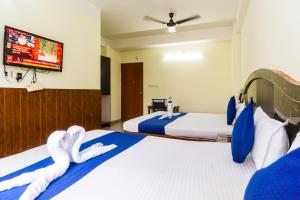 HOTEL NILADRII GALAXY客房内的一张或多张床位