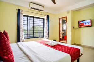 HOTEL NILADRII GALAXY客房内的一张或多张床位