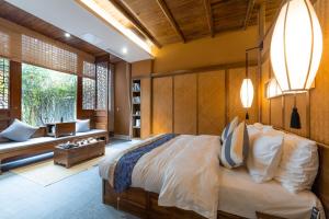 Postel nebo postele na pokoji v ubytování Ganzhou Banjiangxia Homestay + 37 fotografií