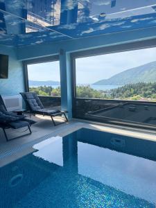 a house with a swimming pool with a view at S-Penthouse in Herceg-Novi