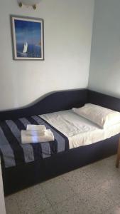 En eller flere senge i et værelse på Exclusive Holiday Home Argentarola