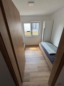 Postel nebo postele na pokoji v ubytování Resort Winklfeld 6a