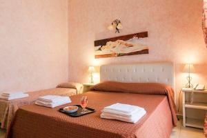 Кровать или кровати в номере Hotel Salento Gold Beach