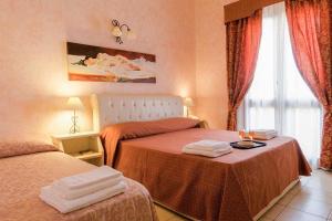 Кровать или кровати в номере Hotel Salento Gold Beach