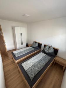 Postel nebo postele na pokoji v ubytování Resort Winklfeld 6a