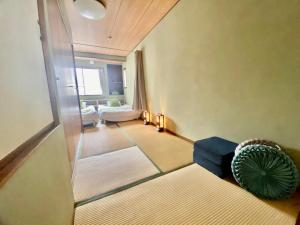 Un ou plusieurs lits dans un hébergement de l'établissement Momodani 72 two-story detached house
