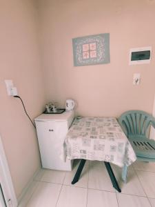 a small room with a table and a chair at kyriaki room 5 in Vouvás