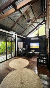 a living room with a table and a couch at Ying Yang House Catangnan in General Luna