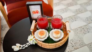 a basket of food and drinks on a table at Sugar Marina Hotel - FASHION - Kata Beach in Kata Beach