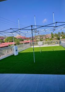 a view of a soccer field with a goal at Izire Home in Tokuse
