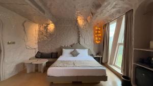 Ένα ή περισσότερα κρεβάτια σε δωμάτιο στο Dragonfly Hotel - The Art Hotel
