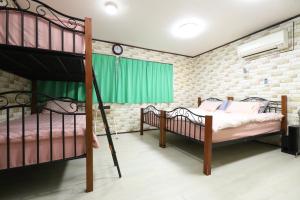 Postel nebo postele na pokoji v ubytování HILDA INN