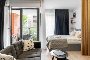 Posteľ alebo postele v izbe v ubytovaní Scala 60C City Center Apartments & Studio by Lion Apartments