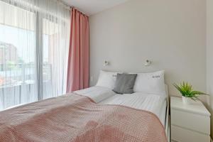 Posteľ alebo postele v izbe v ubytovaní Scala 60C City Center Apartments & Studio by Lion Apartments
