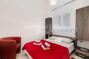 Postel nebo postele na pokoji v ubytování Apartmani Lesjak