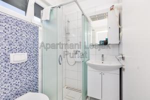 Koupelna v ubytování Apartmani Lesjak + 7 fotografií